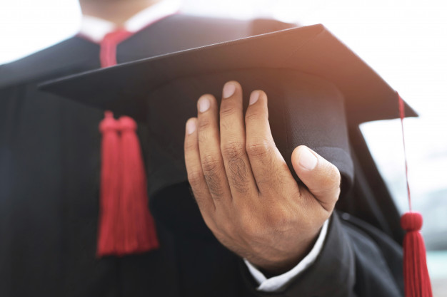 graduation people's hand from kuson virtual class hold hat 